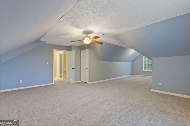 2907 Oakvale Falls Dr, Decatur, GA 30034 - bonus room with carpet floors, baseboards, a ceiling fan, vaulted ceiling, and a textured ceiling