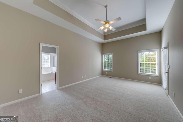 1151 Emperor Ln, Hoschton, GA 30548 - empty room with carpet, a tray ceiling, crown molding, and a ceiling fan