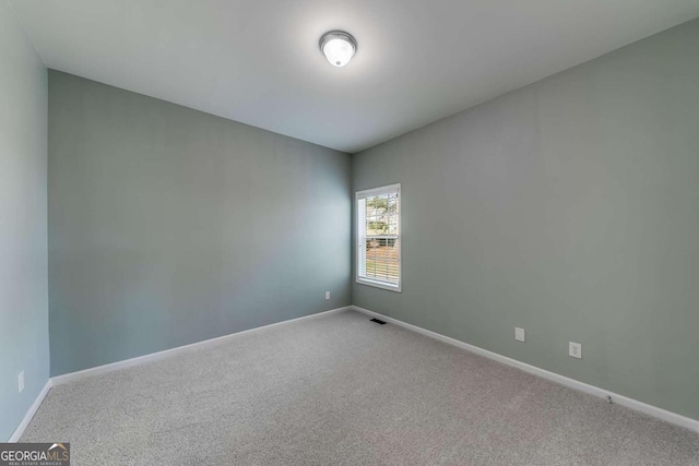 1151 Emperor Ln, Hoschton, GA 30548 - carpeted spare room featuring baseboards