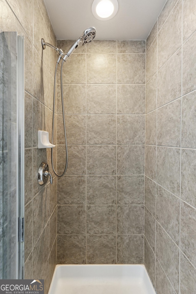 bathroom featuring a stall shower
