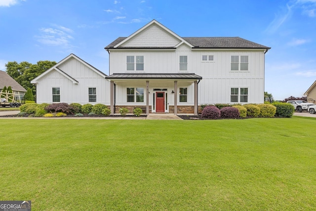 47 Wicklow Ct, Hoschton, GA 30548 - modern farmhouse style home with a standing seam roof, board and batten siding, a front yard, and a metal roof