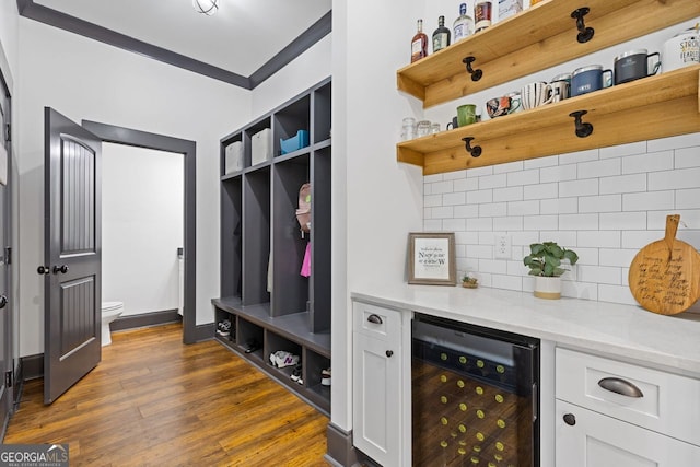 47 Wicklow Ct, Hoschton, GA 30548 - mudroom with wine cooler, dark wood-type flooring, and ornamental molding