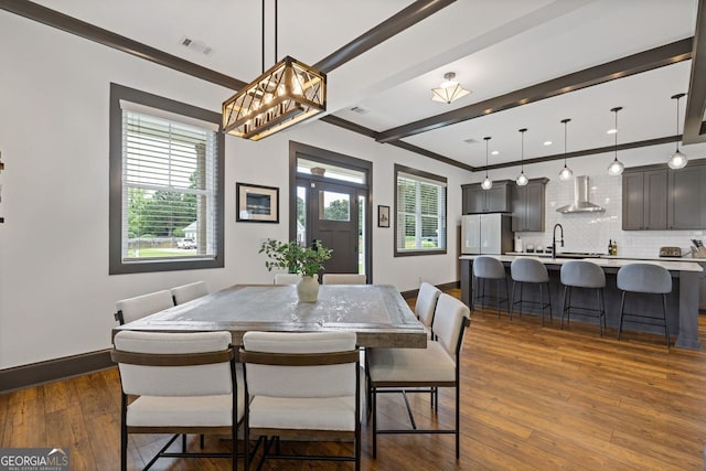 47 Wicklow Ct, Hoschton, GA 30548 - dining space with dark wood-style floors and ornamental molding