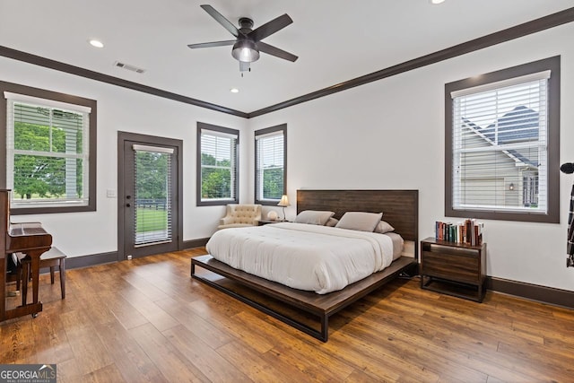 47 Wicklow Ct, Hoschton, GA 30548 - bedroom with access to outside, crown molding, multiple windows, hardwood / wood-style flooring, and recessed lighting