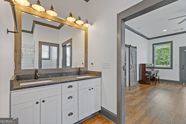 47 Wicklow Ct, Hoschton, GA 30548 - full bath featuring double vanity, wood finished floors, and crown molding