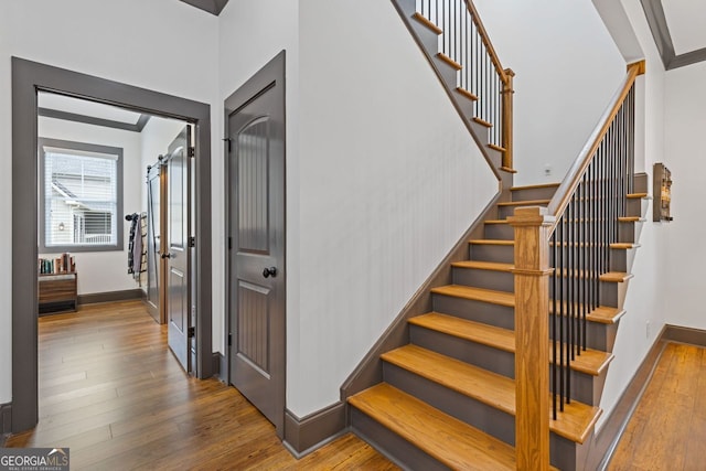 47 Wicklow Ct, Hoschton, GA 30548 - stairway with wood finished floors and baseboards