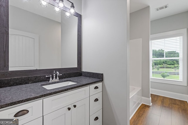 47 Wicklow Ct, Hoschton, GA 30548 - bathroom with vanity and wood finished floors