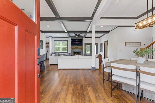 47 Wicklow Ct, Hoschton, GA 30548 - dining space with coffered ceiling, a ceiling fan, dark wood-type flooring, stairs, and beamed ceiling