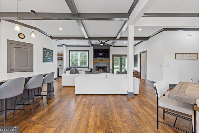 47 Wicklow Ct, Hoschton, GA 30548 - living room featuring coffered ceiling, dark wood-style flooring, a ceiling fan, beamed ceiling, and a fireplace