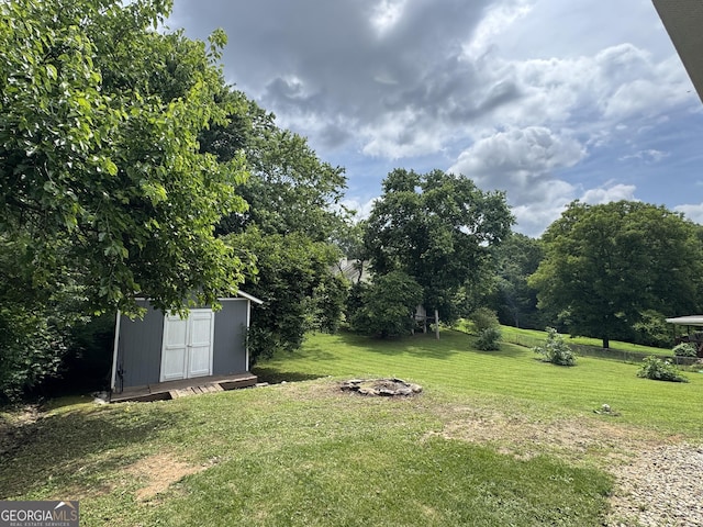 3905 Hunt Dr, Gainesville, GA 30507 - view of grassy yard with a storage shed