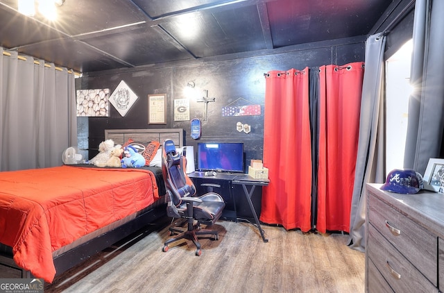 bedroom featuring wood finished floors