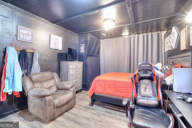 bedroom with wood finished floors