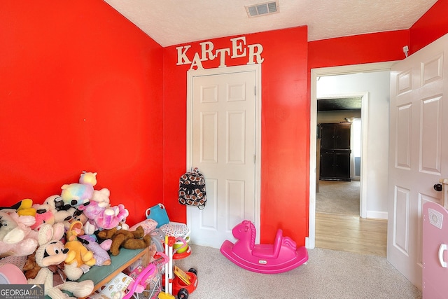 game room with carpet flooring and baseboards