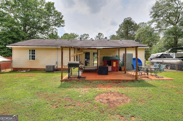 back of property with french doors, a patio, and cooling unit