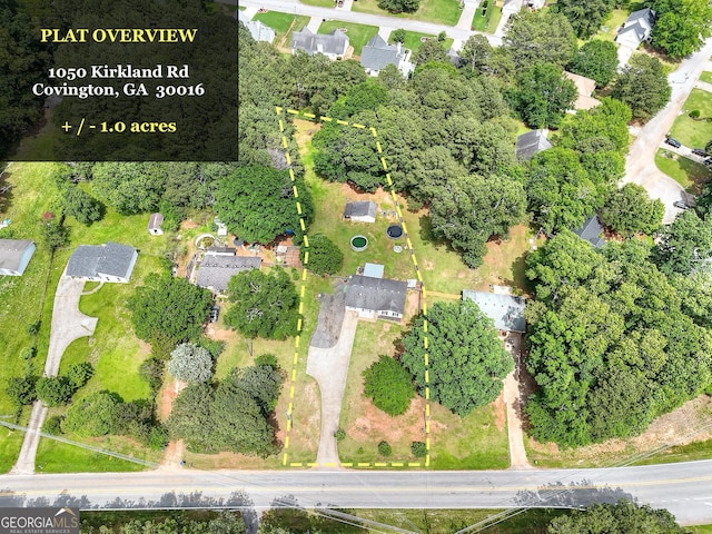 aerial view of property's location featuring property boundaries highlighted and nearby suburban area