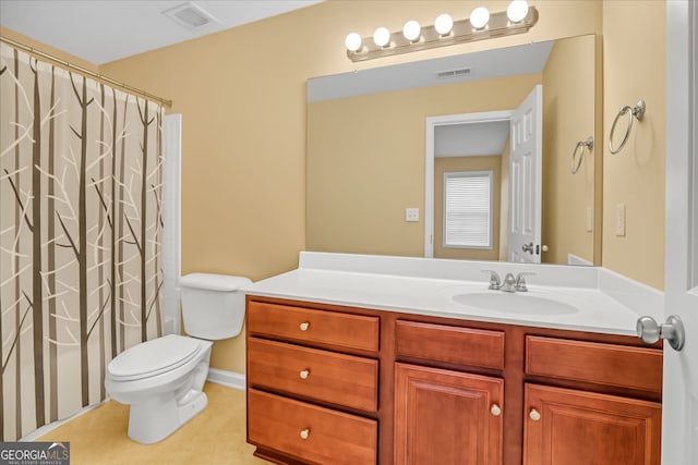 bathroom featuring vanity, toilet, and a shower with shower curtain