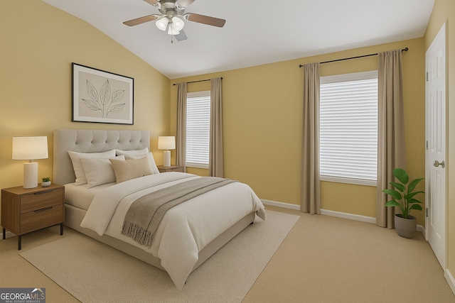 bedroom with lofted ceiling, baseboards, light colored carpet, and a ceiling fan