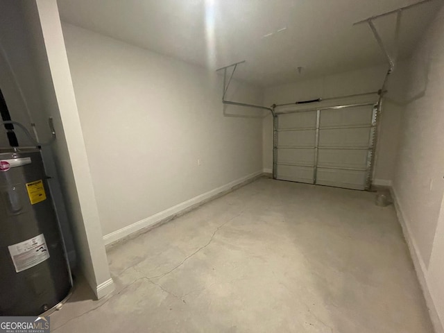 garage featuring water heater and baseboards