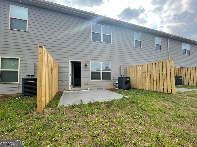 back of property featuring a patio area and central AC unit
