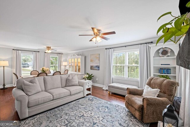 1811 Tilliewood Trl NE, Marietta, GA 30066 - living room featuring baseboards, healthy amount of natural light, ceiling fan, wood finished floors, and crown molding