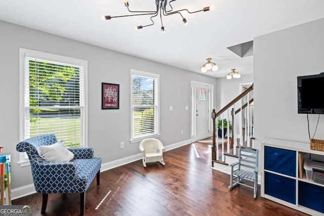 1811 Tilliewood Trl NE, Marietta, GA 30066 - living area with stairs, wood finished floors, baseboards, and a chandelier