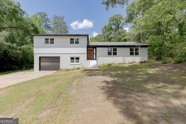 tri-level home featuring driveway and an attached garage