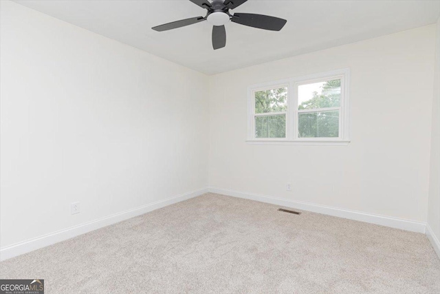 unfurnished room featuring baseboards, carpet flooring, and ceiling fan