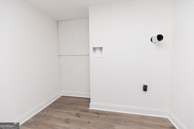 laundry room with hookup for a washing machine, wood finished floors, baseboards, and electric dryer hookup