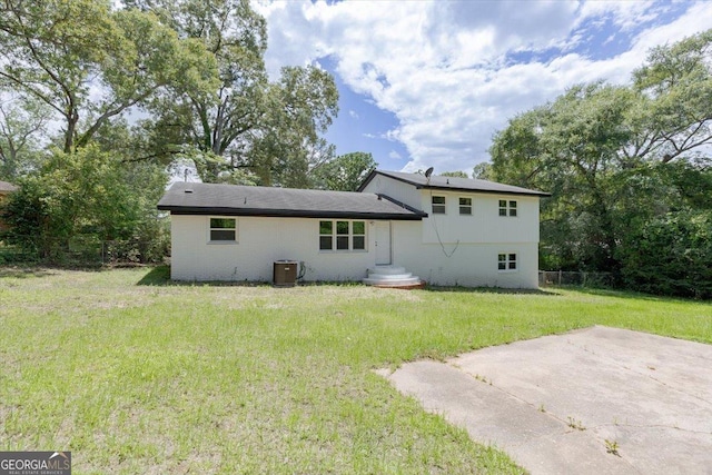rear view of property featuring central AC and a patio