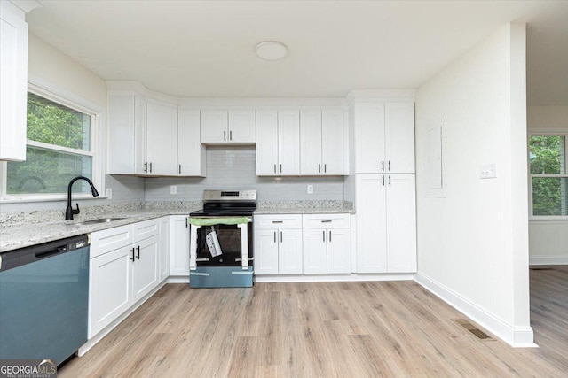 kitchen with dishwasher, stainless steel range with electric stovetop, a sink, and light wood-style flooring