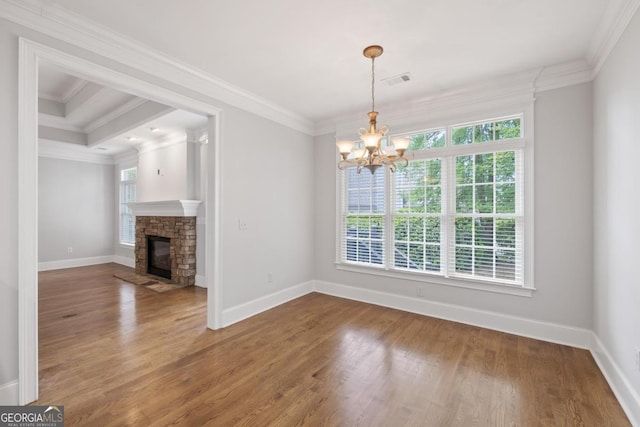 1101 Harbor Ridge Dr, Greensboro, GA 30642 - unfurnished dining area with ornamental molding, a chandelier, wood finished floors, baseboards, and a fireplace