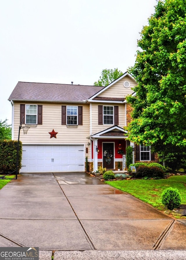 view of front of property with a garage and driveway