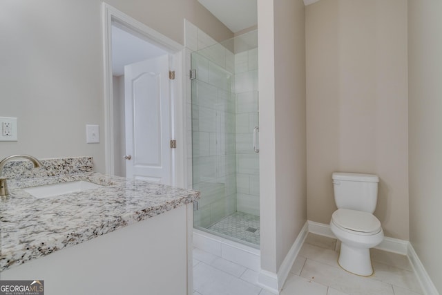 351 Chandler Bluff Ct, Grayson, GA 30017 - bathroom with a sink, a shower stall, baseboards, toilet, and tile patterned flooring