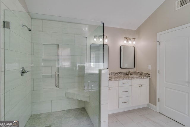 351 Chandler Bluff Ct, Grayson, GA 30017 - bathroom featuring a shower stall, vaulted ceiling, and vanity