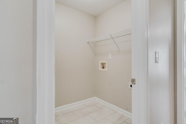 351 Chandler Bluff Ct, Grayson, GA 30017 - washroom featuring washer hookup, light tile patterned flooring, and baseboards