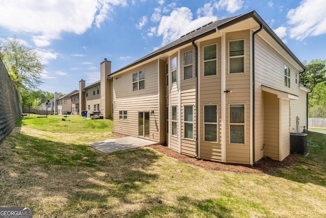 351 Chandler Bluff Ct, Grayson, GA 30017 - rear view of property featuring central air condition unit, a yard, and a patio