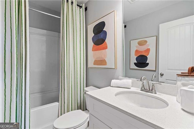 full bathroom featuring shower / bathtub combination with curtain, toilet, and vanity