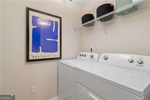 washroom featuring washing machine and dryer