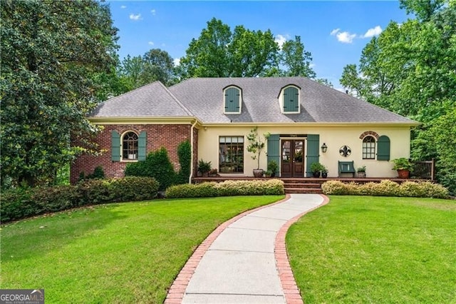 5945 W Andechs Smt, Johns Creek, GA 30097 - french country style house with french doors, a front lawn, stucco siding, and roof with shingles