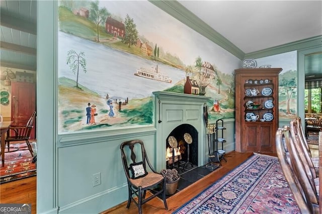 5945 W Andechs Smt, Johns Creek, GA 30097 - sitting room featuring wood finished floors, crown molding, a warm lit fireplace, and beam ceiling