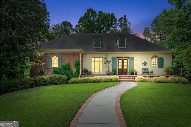 5945 W Andechs Smt, Johns Creek, GA 30097 - view of front of house with french doors, a yard, and stucco siding