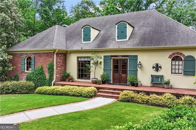 5945 W Andechs Smt, Johns Creek, GA 30097 - view of front facade with a shingled roof, a front yard, french doors, stucco siding, and brick siding
