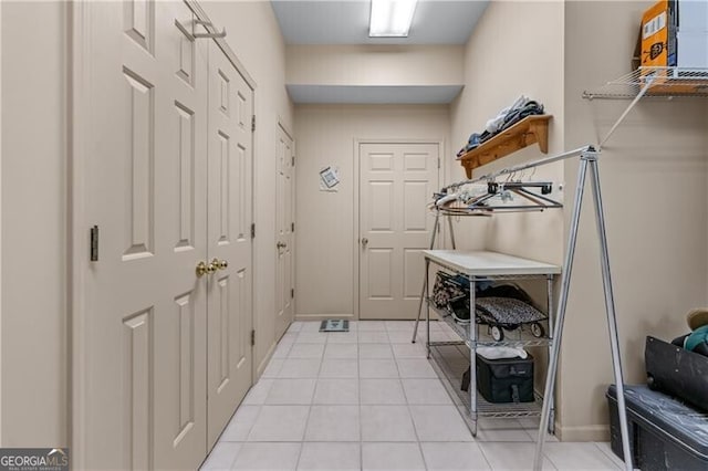 5945 W Andechs Smt, Johns Creek, GA 30097 - laundry area with light tile patterned floors and baseboards