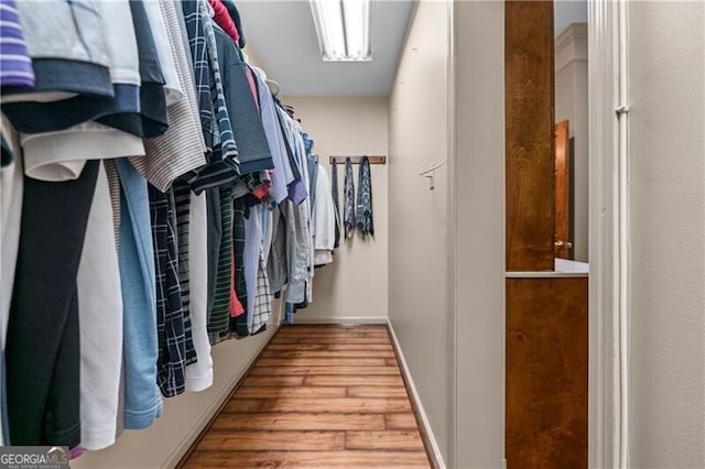5945 W Andechs Smt, Johns Creek, GA 30097 - walk in closet featuring wood finished floors