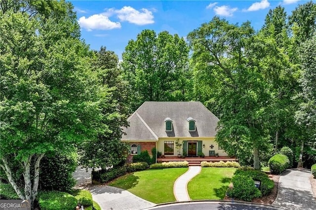 5945 W Andechs Smt, Johns Creek, GA 30097 - view of front of house featuring a front lawn, brick siding, and a shingled roof