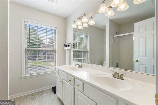 4321 Sugar Maple Chase NW, Acworth, GA 30101 - full bathroom featuring a stall shower, double vanity, a chandelier, baseboards, and toilet