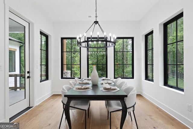 2595 Grassview Dr, Milton, GA 30004 - dining area with a chandelier, plenty of natural light, and light wood-type flooring
