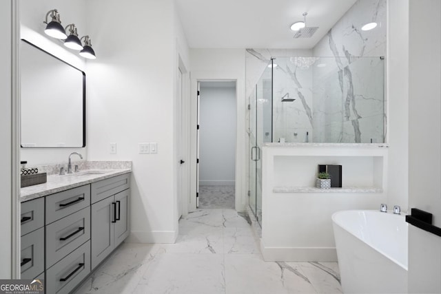 2595 Grassview Dr, Milton, GA 30004 - full bathroom with marble finish flooring, baseboards, a marble finish shower, vanity, and a freestanding tub