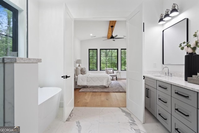 2595 Grassview Dr, Milton, GA 30004 - full bathroom featuring a ceiling fan, ensuite bath, marble finish floors, vanity, and a freestanding bath