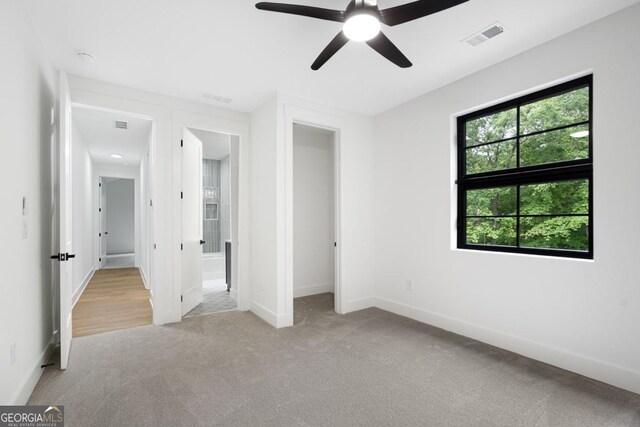 2595 Grassview Dr, Milton, GA 30004 - unfurnished bedroom featuring carpet flooring, baseboards, and ceiling fan